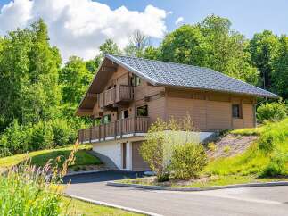 Discover the charm of this stunning wooden chalet nestled in a serene natural setting.