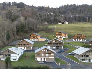 Discover the charm of these stunning chalets nestled in a picturesque mountain setting.
