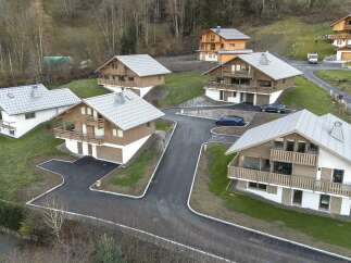 Discover the charm of these stunning chalets nestled in a picturesque mountain setting.