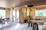 Experience luxury living in this stunning property featuring a cozy living room with a modern design.