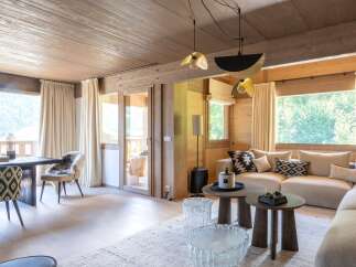 Experience luxury living in this stunning property featuring a cozy living room with a modern design.