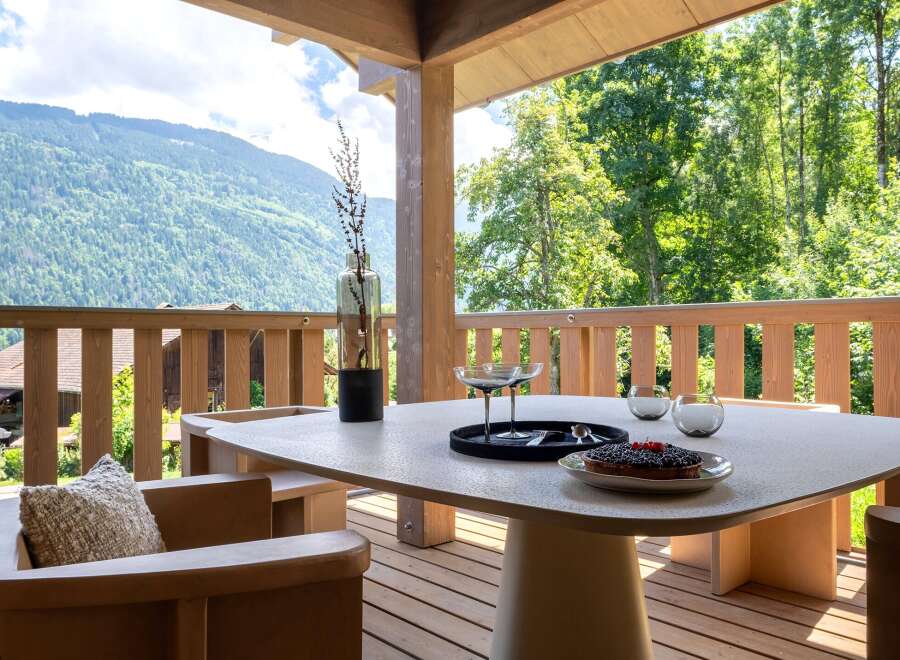 Enjoy breathtaking mountain views from this stunning outdoor dining area.