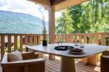 Enjoy breathtaking mountain views from this stunning outdoor dining area.