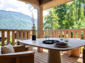 Enjoy breathtaking mountain views from this stunning outdoor dining area.