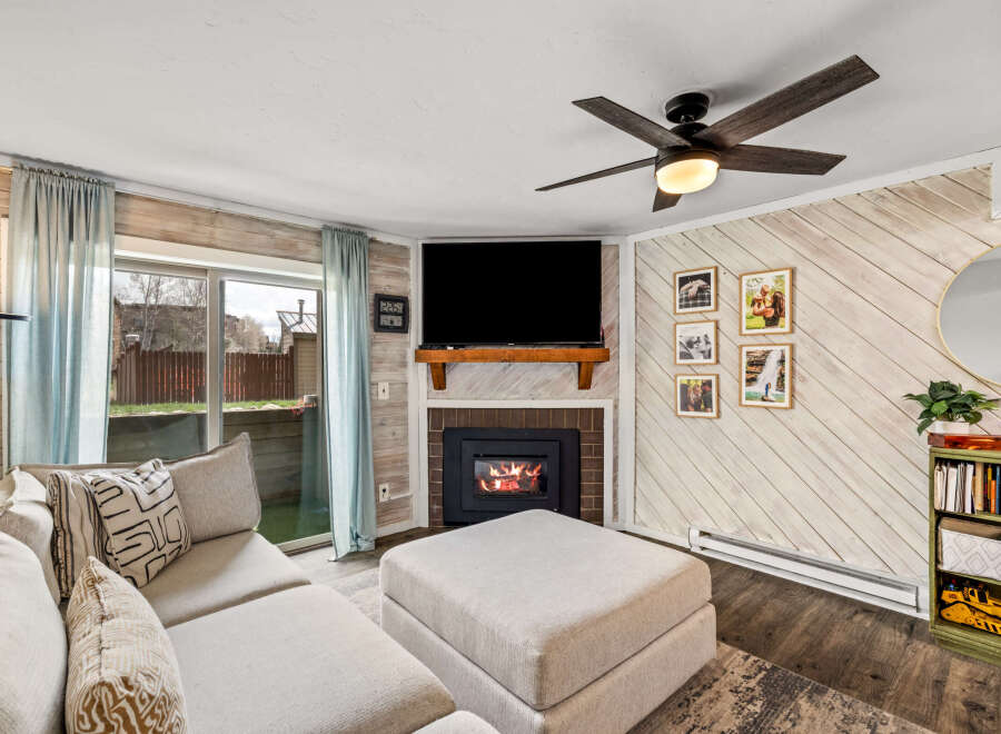 This cozy living room features a fireplace, perfect for those chilly evenings.