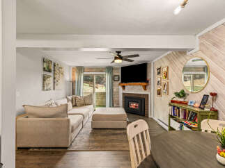 This cozy living space features a modern fireplace, perfect for those chilly evenings.