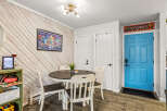 This charming dining area features a stylish round table and four matching chairs, perfect for intimate gatherings.