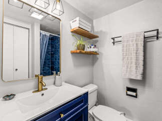 This stunning bathroom boasts a modern design with a touch of elegance.