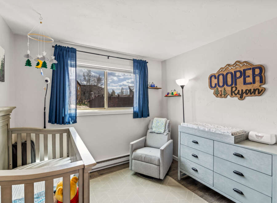 This charming nursery offers a serene and inviting space for your little one.