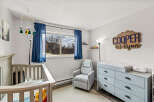 This charming nursery offers a serene and inviting space for your little one.