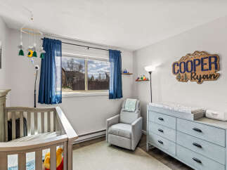 This charming nursery offers a serene and inviting space for your little one.