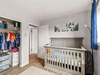 This charming nursery offers a serene and inviting space for your little one.