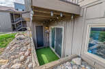Discover the charm of this property, featuring a cozy outdoor space with a touch of greenery.