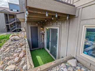 Discover the charm of this property, featuring a cozy outdoor space with a touch of greenery.