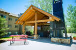 Enjoy outdoor living at its finest with this stunning property featuring a covered patio and a built-in barbecue area.
