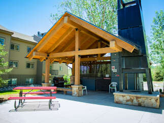 Enjoy outdoor living at its finest with this stunning property featuring a covered patio and a built-in barbecue area.