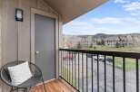 Enjoy stunning views from this charming balcony! This property features a cozy seating area, perfect for relaxing and taking in the scenery.