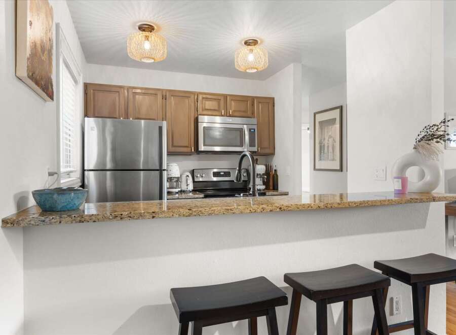 This stunning kitchen boasts modern appliances and stylish design, perfect for culinary enthusiasts.