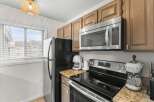 This stunning kitchen boasts modern appliances and ample counter space, perfect for culinary enthusiasts.