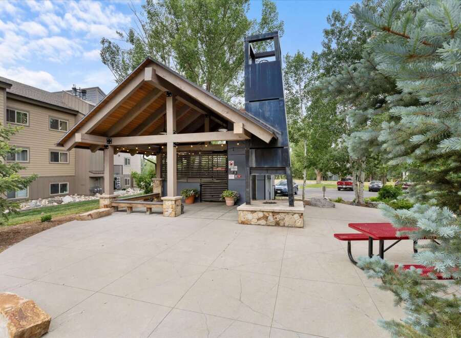 Discover the perfect outdoor retreat with this stunning property featuring a covered patio and a unique fireplace.