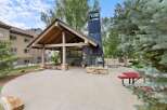 Discover the perfect outdoor retreat with this stunning property featuring a covered patio and a unique fireplace.