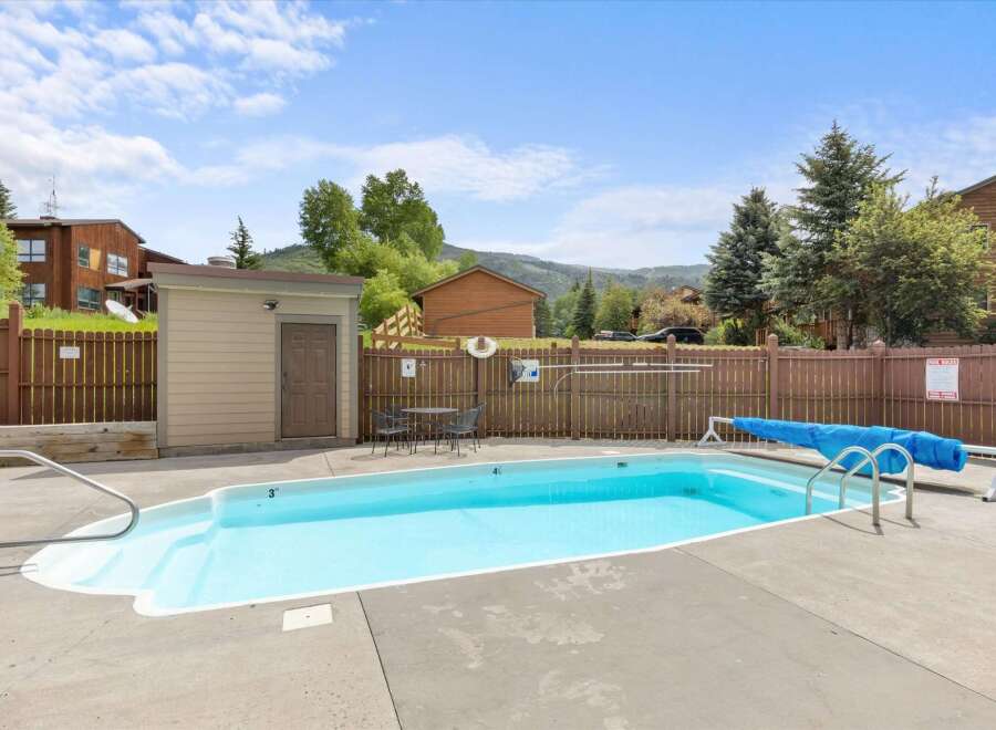 Enjoy a refreshing dip in this inviting outdoor pool, perfect for relaxation and recreation.