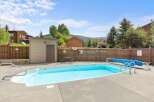 Enjoy a refreshing dip in this inviting outdoor pool, perfect for relaxation and recreation.