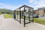 This image showcases a modern bus stop, perfect for those seeking convenient public transportation options.