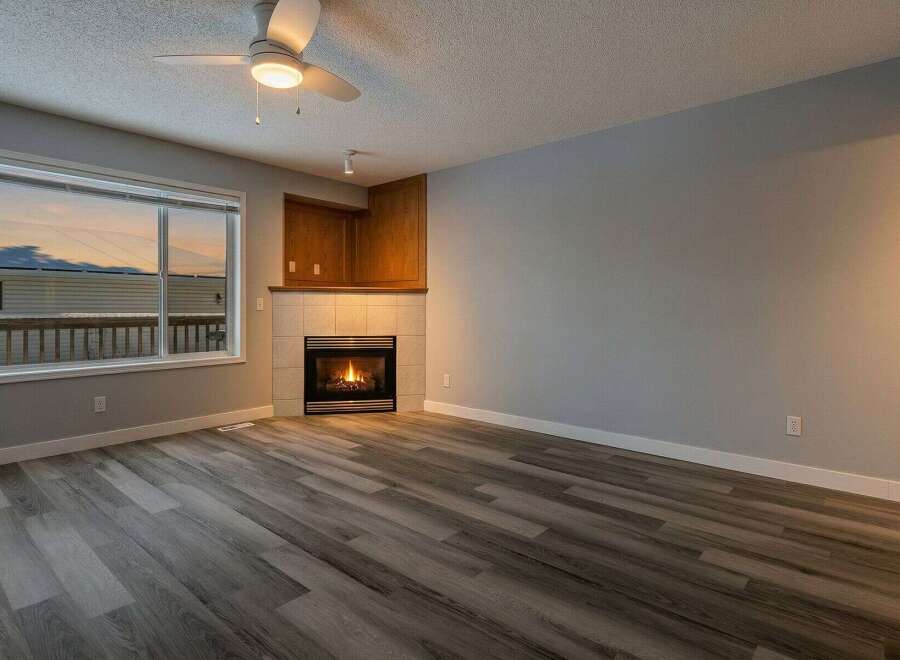 This stunning property boasts a cozy living room with a fireplace, perfect for those chilly evenings.