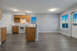 This stunning kitchen boasts beautiful wooden cabinetry and modern appliances, perfect for culinary enthusiasts.