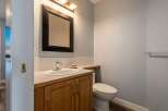This stunning bathroom features a modern design with a sleek vanity and a stylish mirror.