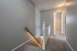 Step into this inviting home and discover a beautifully designed staircase leading to the upper level.