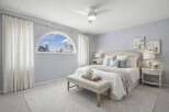 This elegant bedroom offers a serene retreat with its soft color palette and abundant natural light.