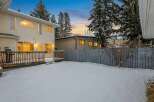 Discover this charming property featuring a spacious backyard blanketed in fresh snow, perfect for winter activities.