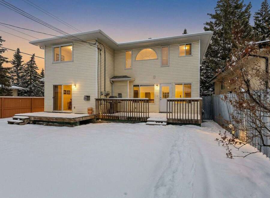 Discover this stunning property featuring a spacious backyard and a charming deck, perfect for outdoor gatherings.