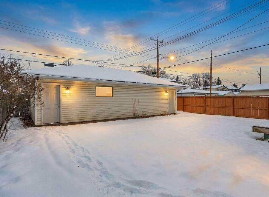 This charming property features a detached garage, perfect for parking or extra storage.