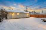 This charming property features a detached garage, perfect for parking or extra storage.