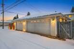 This charming property features a detached garage with two bays, perfect for parking and storage.