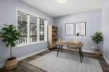 This stunning home office boasts a bright and airy atmosphere, perfect for productivity.