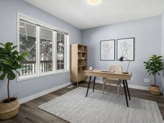 This stunning home office boasts a bright and airy atmosphere, perfect for productivity.