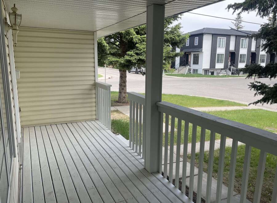 Step onto the inviting porch of this charming property, perfect for enjoying the outdoors.