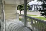 Step onto the inviting porch of this charming property, perfect for enjoying the outdoors.