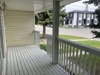 Step onto the inviting porch of this charming property, perfect for enjoying the outdoors.