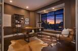 Step into luxury with this stunning home office, featuring a modern desk and a cozy leather armchair.
