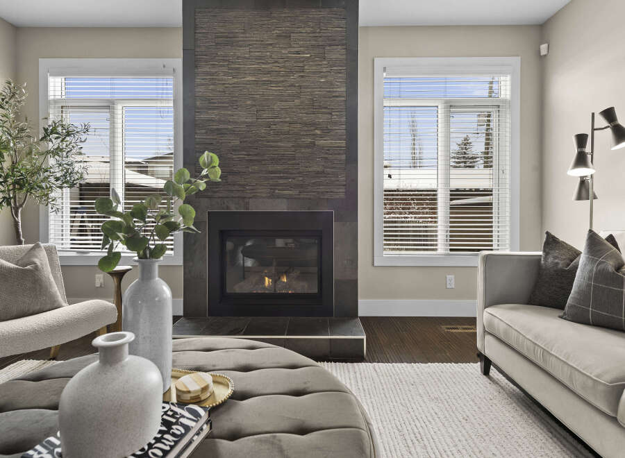 Experience luxury living in this stunning property featuring a cozy fireplace, perfect for those chilly evenings.