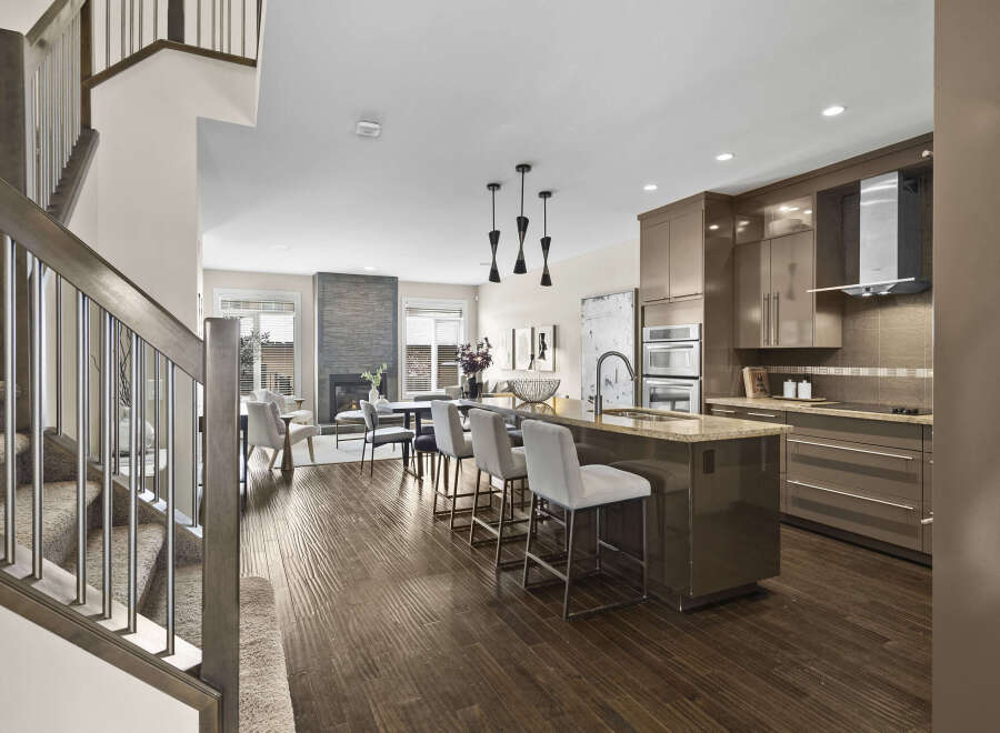 Step into luxury with this stunning open-concept home! The gourmet kitchen boasts sleek cabinetry, stainless steel appliances, and a large island perfect for entertaining.