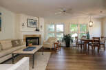 Step into this inviting living space, featuring a cozy fireplace and a comfortable seating area, perfect for relaxation.