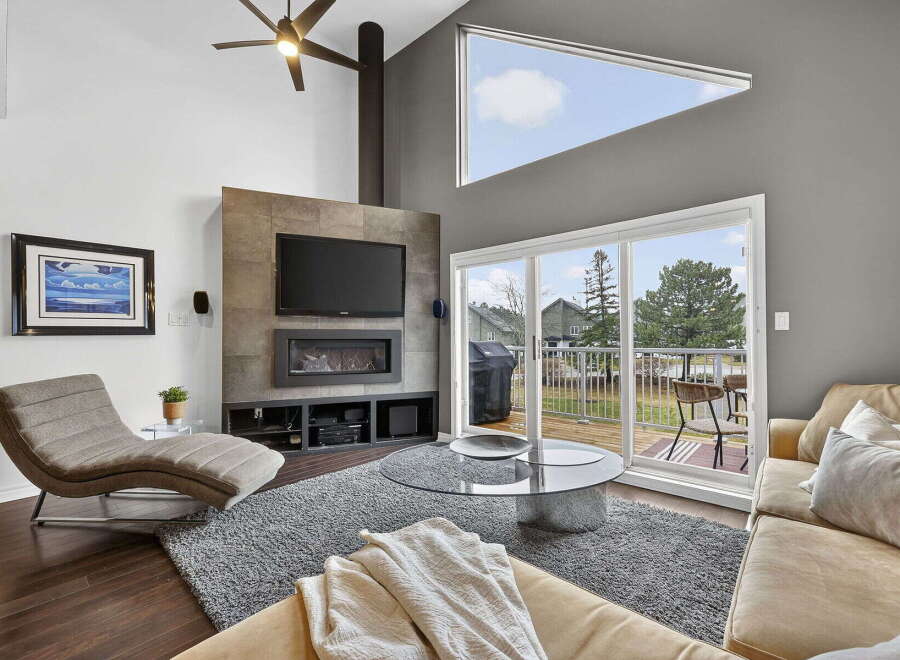 This stunning living room boasts a modern design with a cozy ambiance.