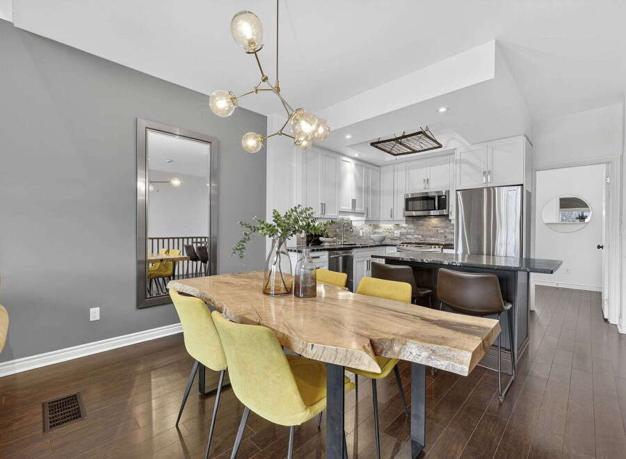 Step into modern elegance with this stunning property! Featuring a beautifully designed kitchen with stainless steel appliances and a stylish island, perfect for entertaining.