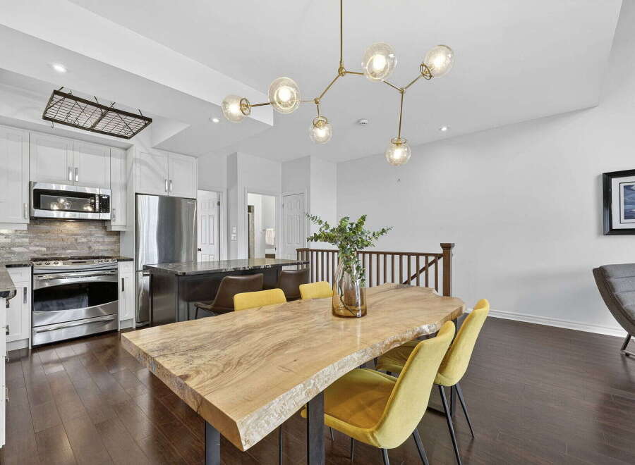 Step into modern elegance with this stunning property! Featuring a gourmet kitchen with stainless steel appliances and a spacious island, perfect for culinary enthusiasts.